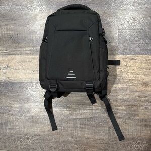 Black Camera Backpack with rain bag. New with tags